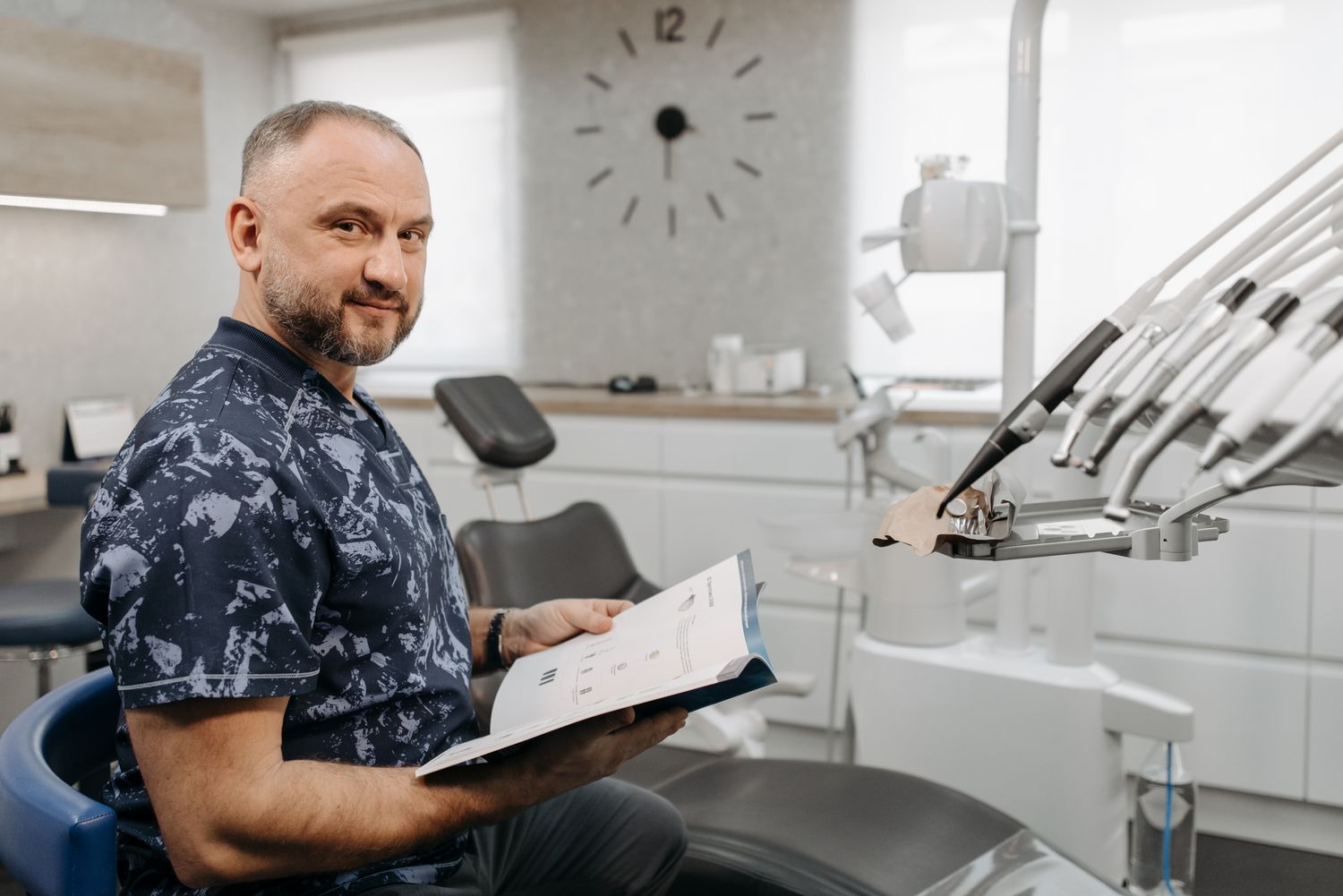 A dentist reviewing patient notes